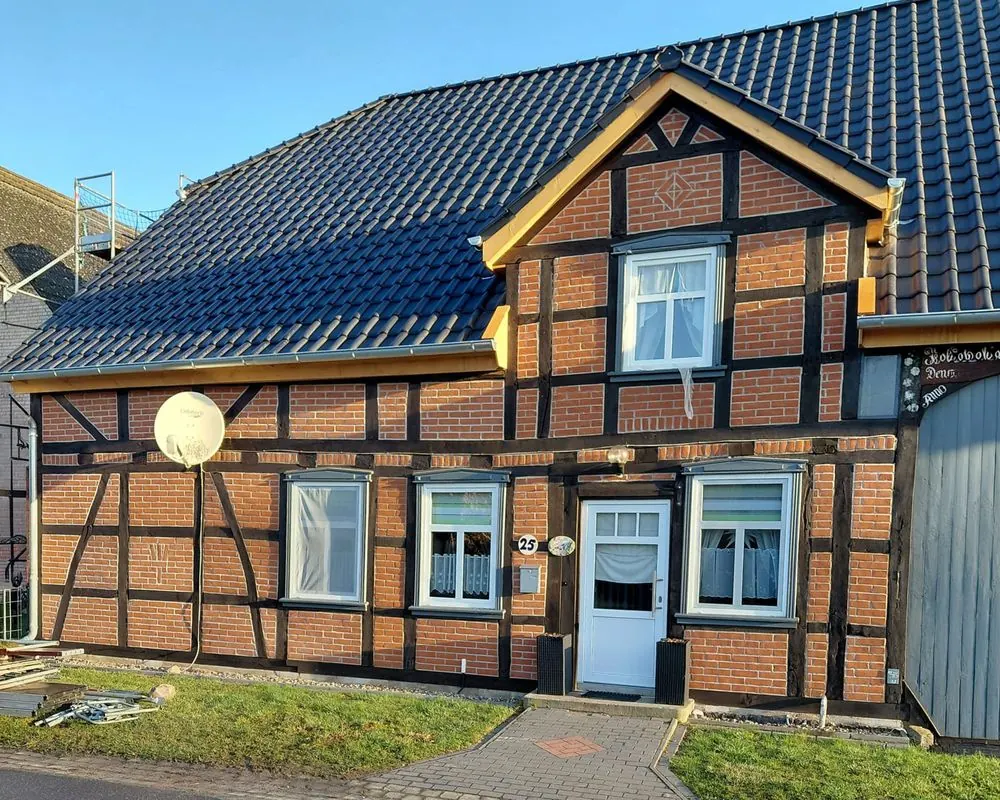 Sanierter Fachwerkbalken nach Restaurierung durch Herms Holzbau